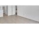 Bedroom with tile flooring, showing access to the bathroom and kitchen, and ample space at 46 Silver Falls Cir, Kissimmee, FL 34743
