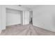 Bedroom features plush carpeting, closet, and neutral color scheme at 46 Silver Falls Cir, Kissimmee, FL 34743