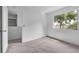 Bright bedroom with carpeted floors and a large window providing natural light at 46 Silver Falls Cir, Kissimmee, FL 34743