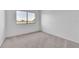 Bedroom with neutral carpet, a large window for natural light, and ample space at 46 Silver Falls Cir, Kissimmee, FL 34743