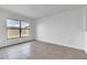 Bedroom with a window providing natural light and tile flooring, ready for personalization at 46 Silver Falls Cir, Kissimmee, FL 34743