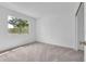 Bright bedroom with carpeted floors and a large window providing ample natural light at 46 Silver Falls Cir, Kissimmee, FL 34743