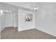 Inviting dining room showcasing sleek tile floors, modern pendant lighting, and convenient access to the kitchen at 46 Silver Falls Cir, Kissimmee, FL 34743