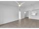 Spacious living room with tile flooring, neutral decor, and open layout to the kitchen at 46 Silver Falls Cir, Kissimmee, FL 34743