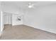 Open-concept living area featuring tile floors, modern lighting, and views to the kitchen at 46 Silver Falls Cir, Kissimmee, FL 34743