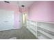 Bedroom featuring a shelving unit and a closet for ample storage and organization at 473 Oviedo Blvd, Oviedo, FL 32765