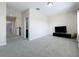 Bright, carpeted bonus room boasting neutral walls, recessed lighting, and a sleek entertainment center at 473 Oviedo Blvd, Oviedo, FL 32765