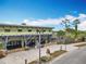 Exterior of community building with ample parking, palm trees, and inviting entryway at 473 Oviedo Blvd, Oviedo, FL 32765