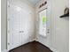 Hallway featuring hardwood floors, white trim, and white doors at 473 Oviedo Blvd, Oviedo, FL 32765