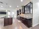 Elegant kitchen design features dark cabinets, modern stainless appliances, and hardwood floors at 473 Oviedo Blvd, Oviedo, FL 32765