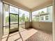 Screened lanai with brick flooring, offering an enjoyable outdoor space to relax and entertain at 473 Oviedo Blvd, Oviedo, FL 32765