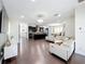 Open-concept living area with hardwood floors, comfortable seating, and ample natural light at 473 Oviedo Blvd, Oviedo, FL 32765