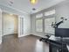 Bright office featuring hardwood floors, recessed lighting, neutral paint, and large windows providing ample natural light at 473 Oviedo Blvd, Oviedo, FL 32765