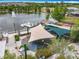Aerial view of a playground with sunshades, swan boat dock, and lake view, offering a vibrant community space at 473 Oviedo Blvd, Oviedo, FL 32765