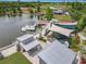 Aerial view of lake playground with swan boat dock, covered structures, and lake views for community fun at 473 Oviedo Blvd, Oviedo, FL 32765