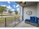 Cozy balcony with comfortable seating, a ceiling fan and a view of the neighborhood at 4731 Clock Tower Dr # 105, Kissimmee, FL 34746