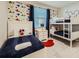 Themed bedroom with bunkbeds, a single bed and decor at 4731 Clock Tower Dr # 105, Kissimmee, FL 34746