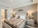 Comfortable bedroom with a queen-sized bed, bedside tables with lamps, and closet at 4731 Clock Tower Dr # 105, Kissimmee, FL 34746