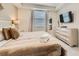 Relaxing bedroom with a queen-sized bed, dresser with mirror, and stylish decor at 4731 Clock Tower Dr # 105, Kissimmee, FL 34746
