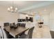 Open concept dining room, white kitchen and breakfast bar are visible in the background with modern decor at 4731 Clock Tower Dr # 105, Kissimmee, FL 34746