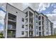 Modern apartment complex with private balconies providing residents with outdoor relaxation at 4731 Clock Tower Dr # 105, Kissimmee, FL 34746