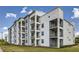 Contemporary apartment building with multiple floors and private balconies, providing outdoor living at 4731 Clock Tower Dr # 105, Kissimmee, FL 34746