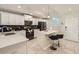 Charming kitchen featuring white cabinets, stainless steel appliances, and a breakfast bar at 4731 Clock Tower Dr # 105, Kissimmee, FL 34746