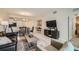 Spacious open-concept living and dining area with modern finishes and plenty of natural light at 4731 Clock Tower Dr # 105, Kissimmee, FL 34746