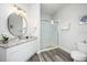 Bathroom featuring a vanity with granite countertop and a glass-enclosed shower at 4802 Cayview Ave # 301, Orlando, FL 32819