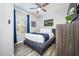 Bedroom showcasing a bed, a dresser, and modern decor with natural light at 4802 Cayview Ave # 301, Orlando, FL 32819
