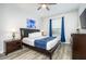 Bedroom with a bed, nightstands, dresser, TV, and neutral decor at 4802 Cayview Ave # 301, Orlando, FL 32819