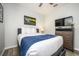 Bedroom featuring a bed, dresser, and modern decor with wood-look floors at 4802 Cayview Ave # 301, Orlando, FL 32819