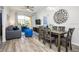 View of a decorated living and dining room with modern furnishings and balcony access at 4802 Cayview Ave # 301, Orlando, FL 32819