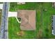 Aerial view shows a well-maintained house with a lawn and landscaping within a quiet neighborhood setting at 5076 Nw 21St Loop, Ocala, FL 34482