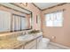 This bathroom features a well-lit vanity and granite countertops at 5076 Nw 21St Loop, Ocala, FL 34482