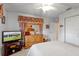 Well-lit bedroom with a spacious closet, dresser, and a bright window at 5076 Nw 21St Loop, Ocala, FL 34482