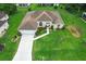 Well-maintained home featuring manicured lawn, welcoming front entrance, and attached two-car garage at 5076 Nw 21St Loop, Ocala, FL 34482