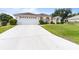 Lovely single-story home with a long driveway and well-maintained front yard, perfect for suburban living at 5076 Nw 21St Loop, Ocala, FL 34482