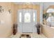 Bright foyer with a decorative front door, tile flooring, and stylish decorations that create a welcoming entrance at 5076 Nw 21St Loop, Ocala, FL 34482