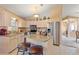This spacious kitchen features stainless steel appliances, granite countertops, and a cozy breakfast bar at 5076 Nw 21St Loop, Ocala, FL 34482