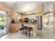 Bright kitchen features granite countertops, a center island, stainless appliances and casual barstool seating at 5076 Nw 21St Loop, Ocala, FL 34482