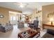 Inviting living area with vaulted ceilings, comfortable seating, and a decorative entryway, creating a warm ambiance at 5076 Nw 21St Loop, Ocala, FL 34482