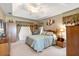 Relaxing bedroom boasts a tray ceiling, natural light, and warm tones for a comfortable retreat at 5076 Nw 21St Loop, Ocala, FL 34482