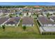 Bird's eye view shows neighborhood layouts, yards, and cohesive community planning at 523 Tortugas St, Haines City, FL 33844