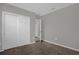 A simple and bright bedroom with a neutral color scheme and a double door closet at 523 Tortugas St, Haines City, FL 33844