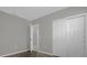 A spacious bedroom offers double door closet and is adjacent to a carpeted hallway at 523 Tortugas St, Haines City, FL 33844
