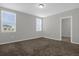 Comfortable carpeted bedroom with neutral walls and multiple windows for natural light at 523 Tortugas St, Haines City, FL 33844