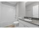 Well-lit bathroom features a shower-tub combo, vanity with sink, and granite countertops at 531 Tortugas St, Haines City, FL 33844