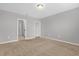 Spacious bedroom featuring neutral color palette and cozy brown carpeting at 531 Tortugas St, Haines City, FL 33844