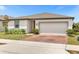 Charming single-story home features a two-car garage and well-manicured front lawn at 531 Tortugas St, Haines City, FL 33844